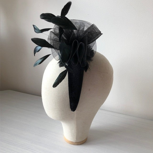 Fascinator black on a black velvet headband with soft feathers and a black swirl rose MHB13