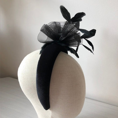 Fascinator black on a black velvet headband with soft feathers and a black swirl rose MHB13