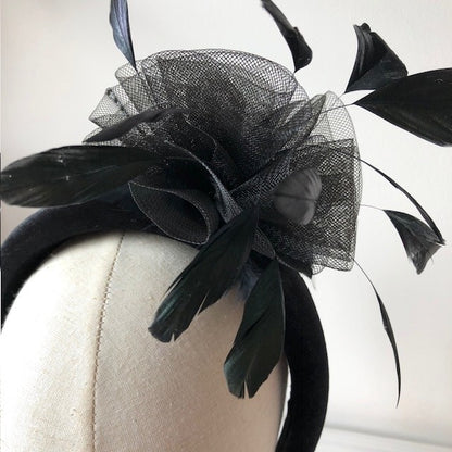 Fascinator black on a black velvet headband with soft feathers and a black swirl rose MHB13