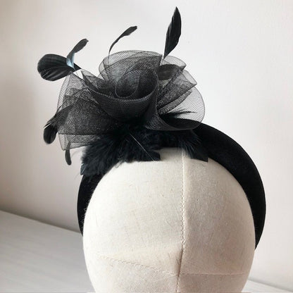 Fascinator black on a black velvet headband with soft feathers and a black swirl rose MHB13