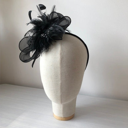 Fascinator black on a slim headband with soft quail feathers with a black bow MHB12