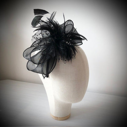 Fascinator black on a slim headband with soft quail feathers with a black bow MHB12